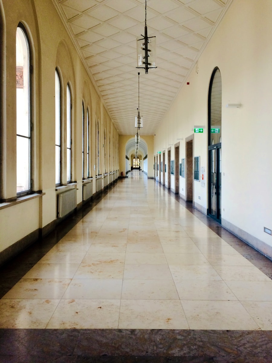 Arched school corridor with polished floors and tall windows