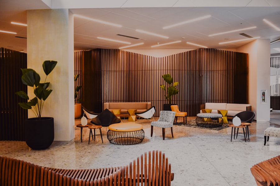 Modern hotel lobby with wood-slat walls and lounge seating