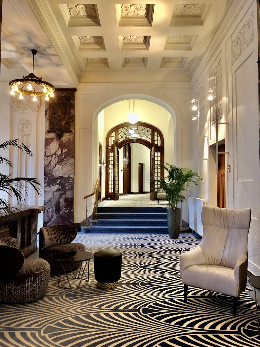 Classic hotel lobby with patterned carpet and armchairs