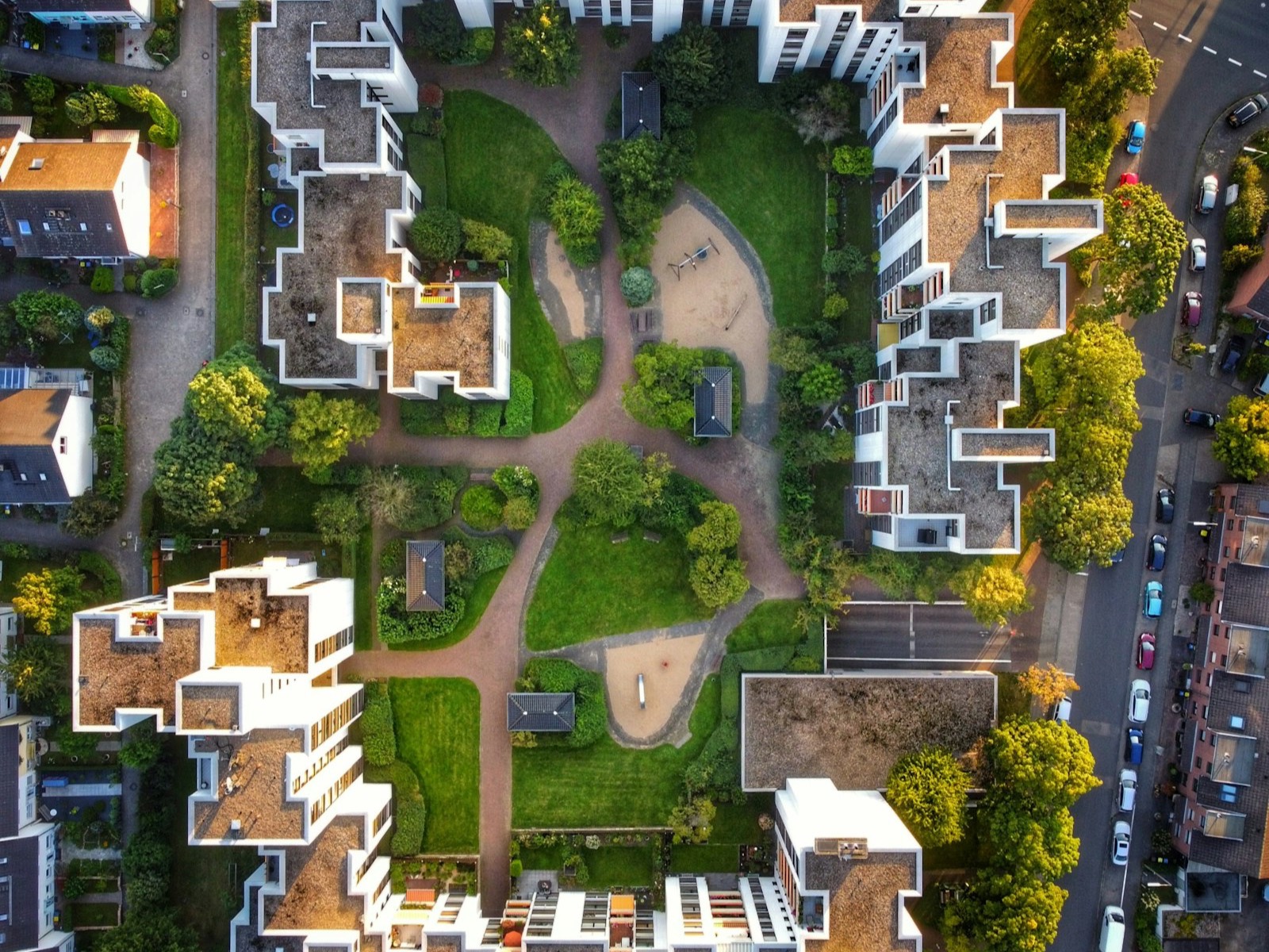 Aerial view of an apartment complex around a landscaped courtyard