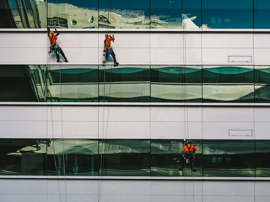 Rope-access window washers on a glass office building
