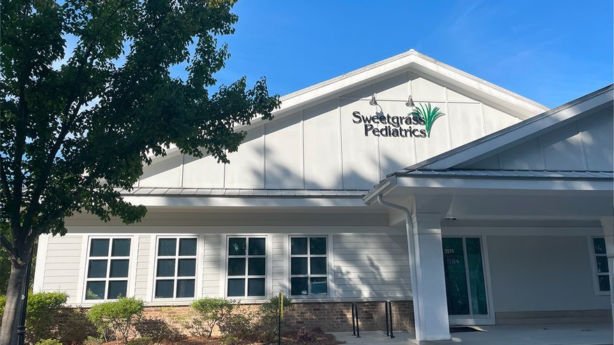 Sweetgrass Pediatrics office building with its roofline sign