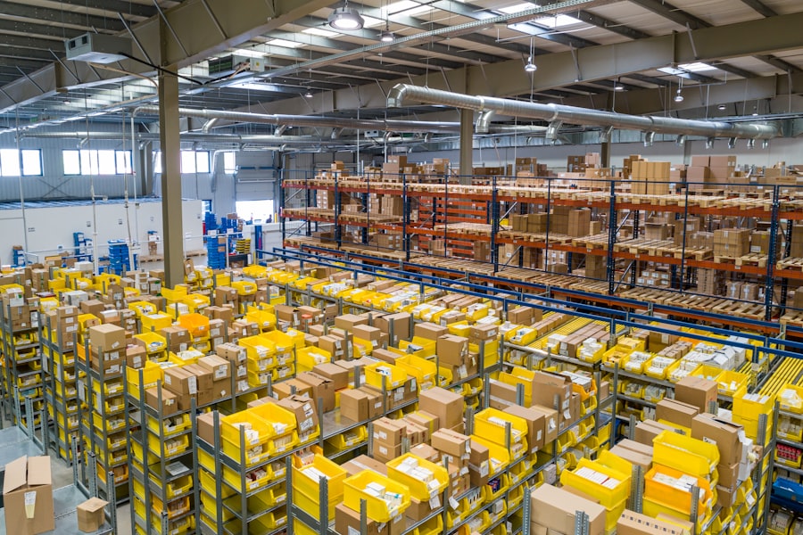 Warehouse floor stacked with yellow plastic crates